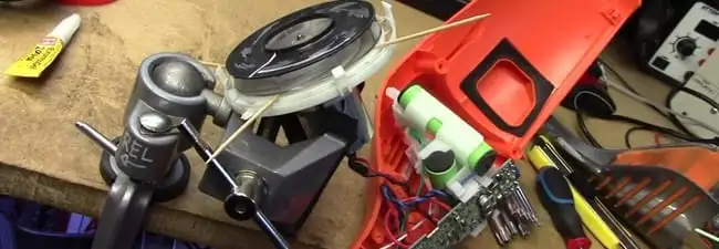 Vacuum cleaner repair parts and tools on a workbench in Omaha, NE